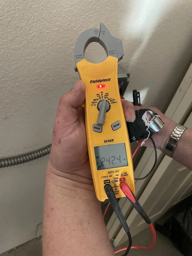 Voltage testing with clamp meter during Aluminum Wiring Replacement in Chelsea